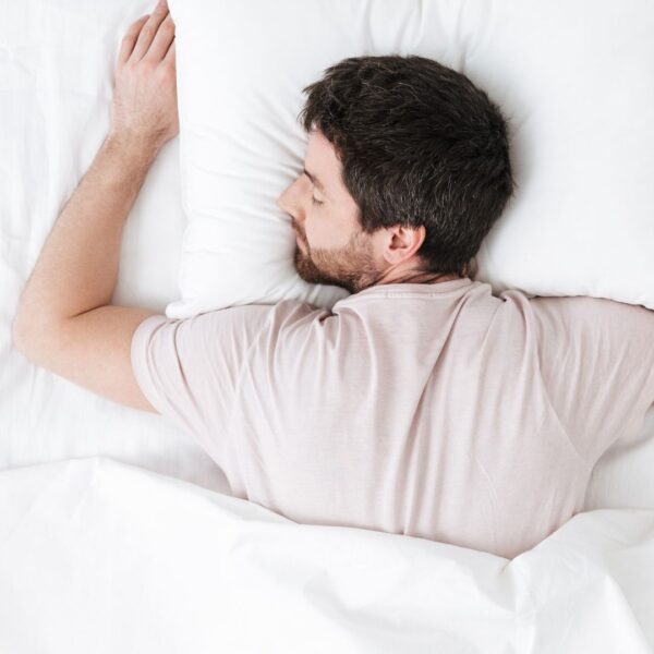man sleeping on stomach