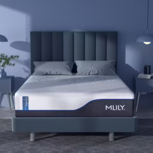 Blue-hued bedroom featuring an MLILY mattress with white top on an upholstered bed frame.